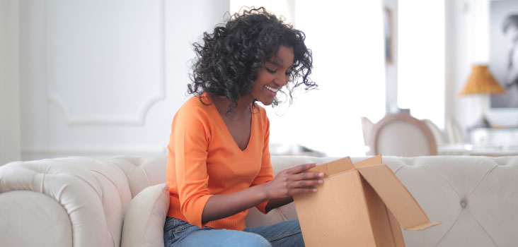 Woman opening kit package